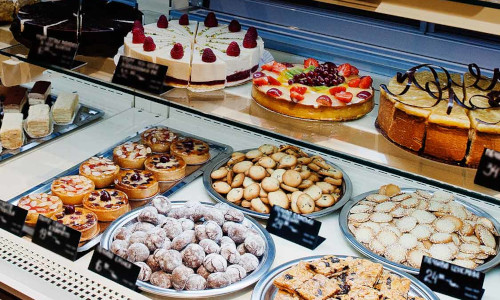 A delightful array of fresh pastries and cakes—indulge in your favorite sweet treats.