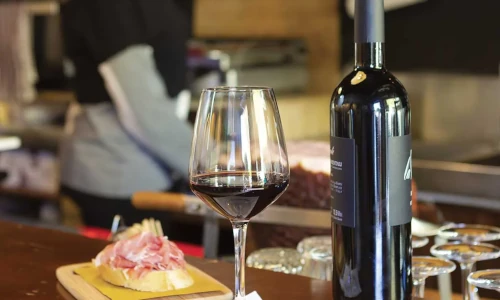 A perfect pairing—fine wine and gourmet tapas for a sophisticated dining experience.