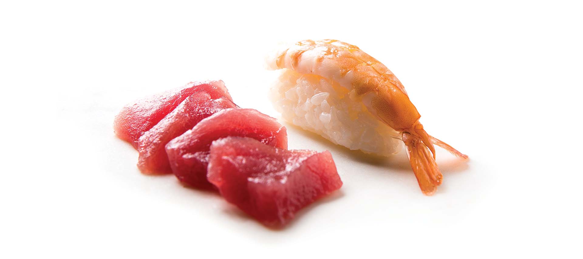 Fresh sushi and sashimi served in a facility equipped with commercial laundry equipment, including commercial tumble dryers and automatic ironing machines.