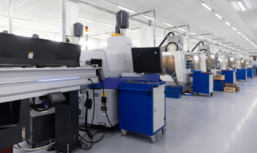 Electrolux automatic iron machines in a well-lit industrial facility in Australia.