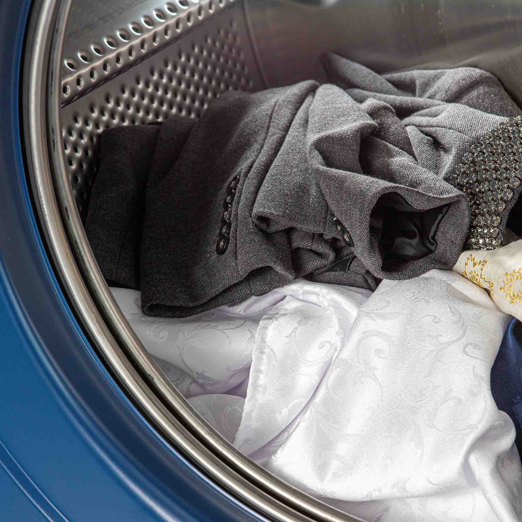 Clothes being washed in commercial washer machine