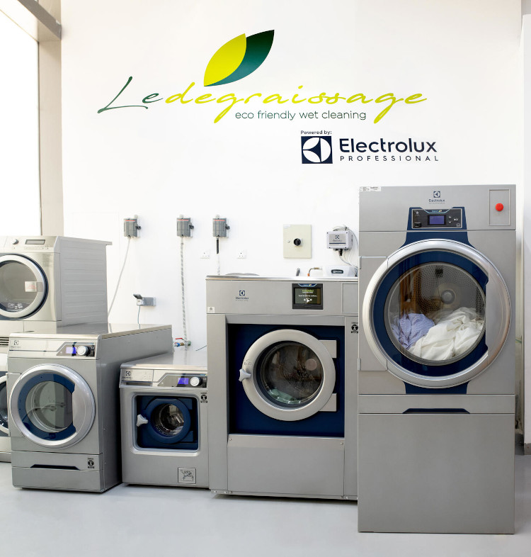 A row of washing machines lined up in a laundry room, showcasing their modern design and functionality.